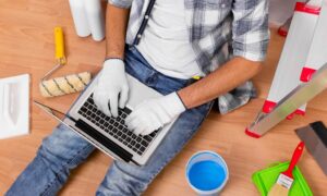 A professional house painter in Trumbull, CT, performing a detailed surface inspection of a residential exterior, identifying the preparation needs required to withstand local humidity and seasonal temperature swings.