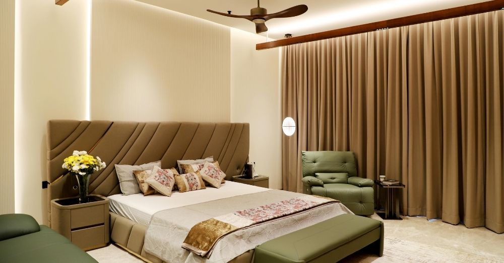 luxurious bedroom with a tufted headboard and green accents.