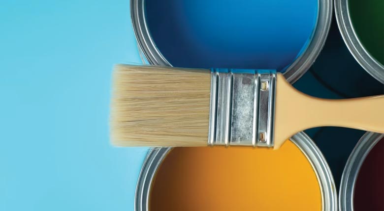 A Paint Brush and a yellow and blue paint