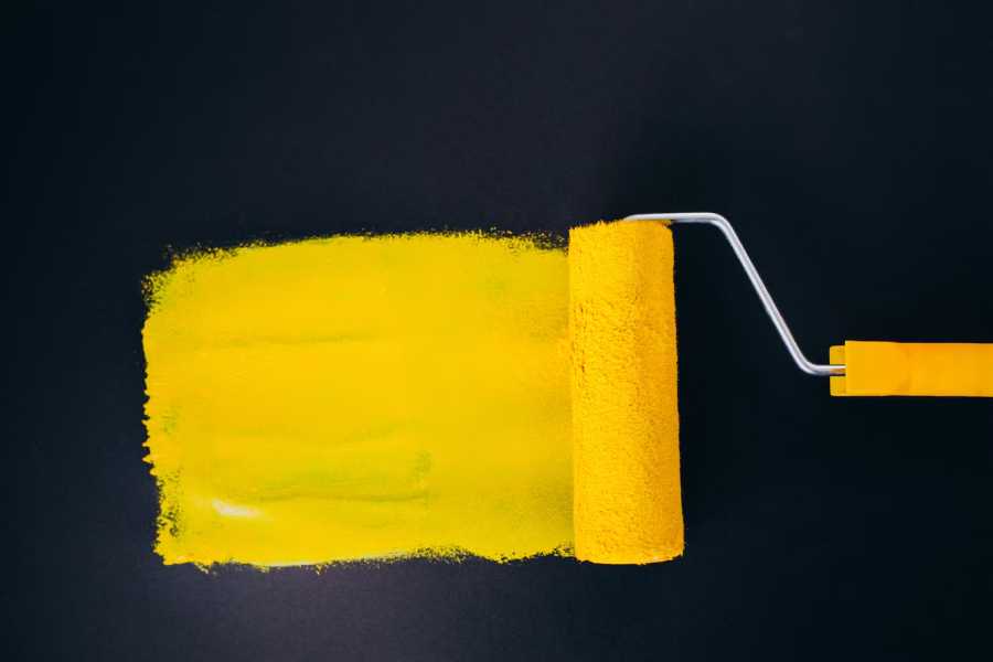 A roller paint with a yellow paint