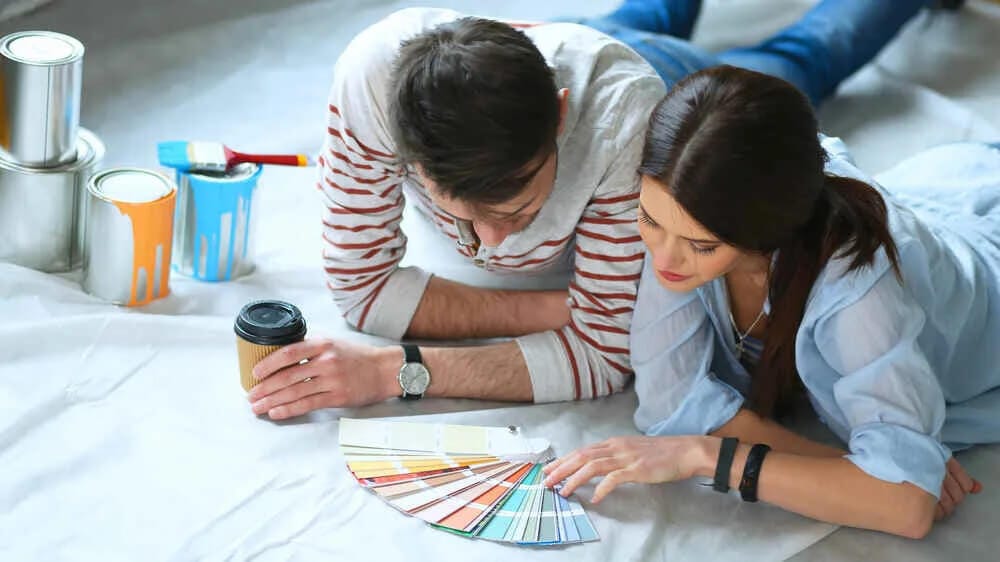 Male and Female selecting color palette for paint